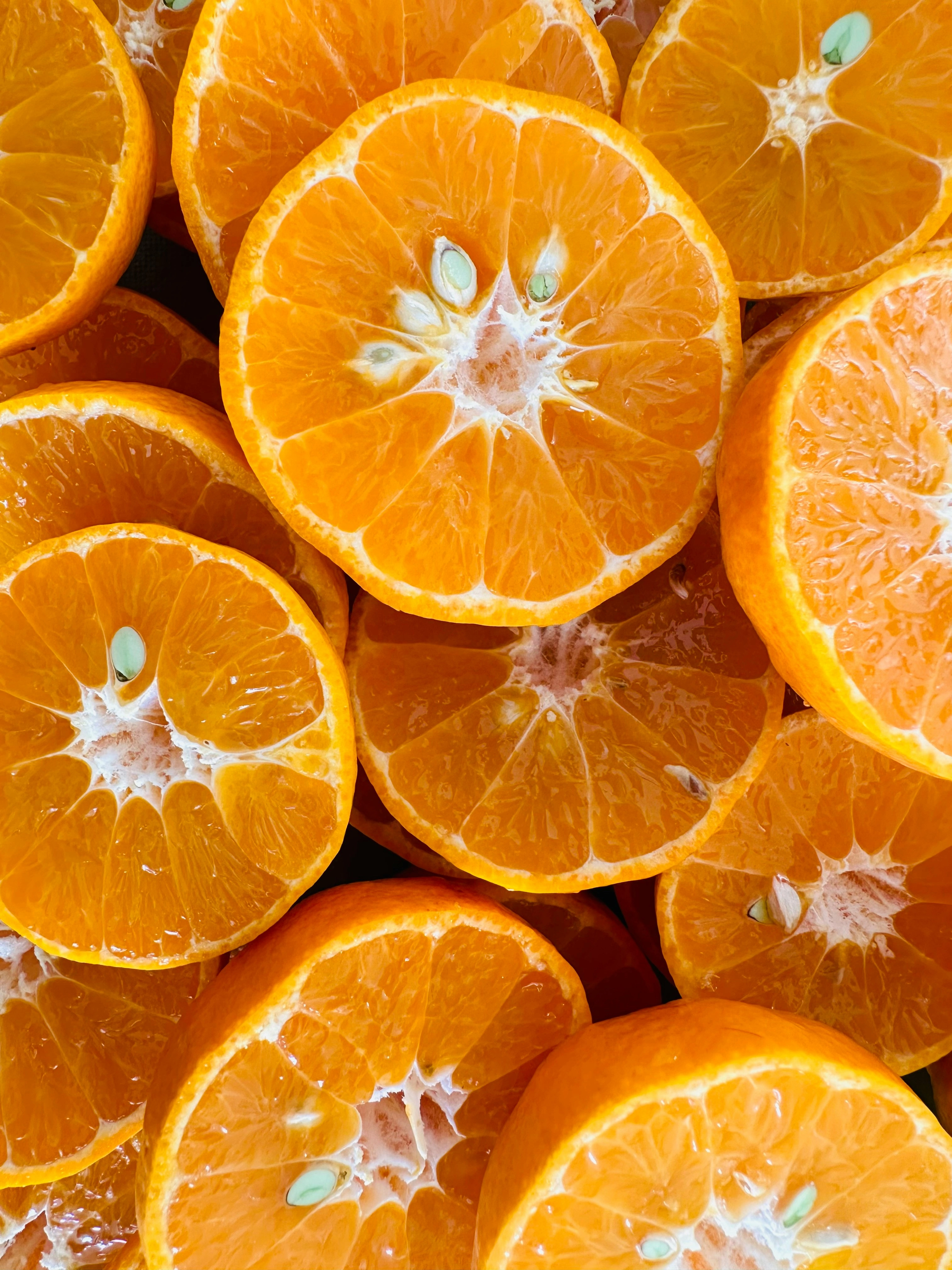 a photo of a pile of halved oranges by John Cameron via Unsplash