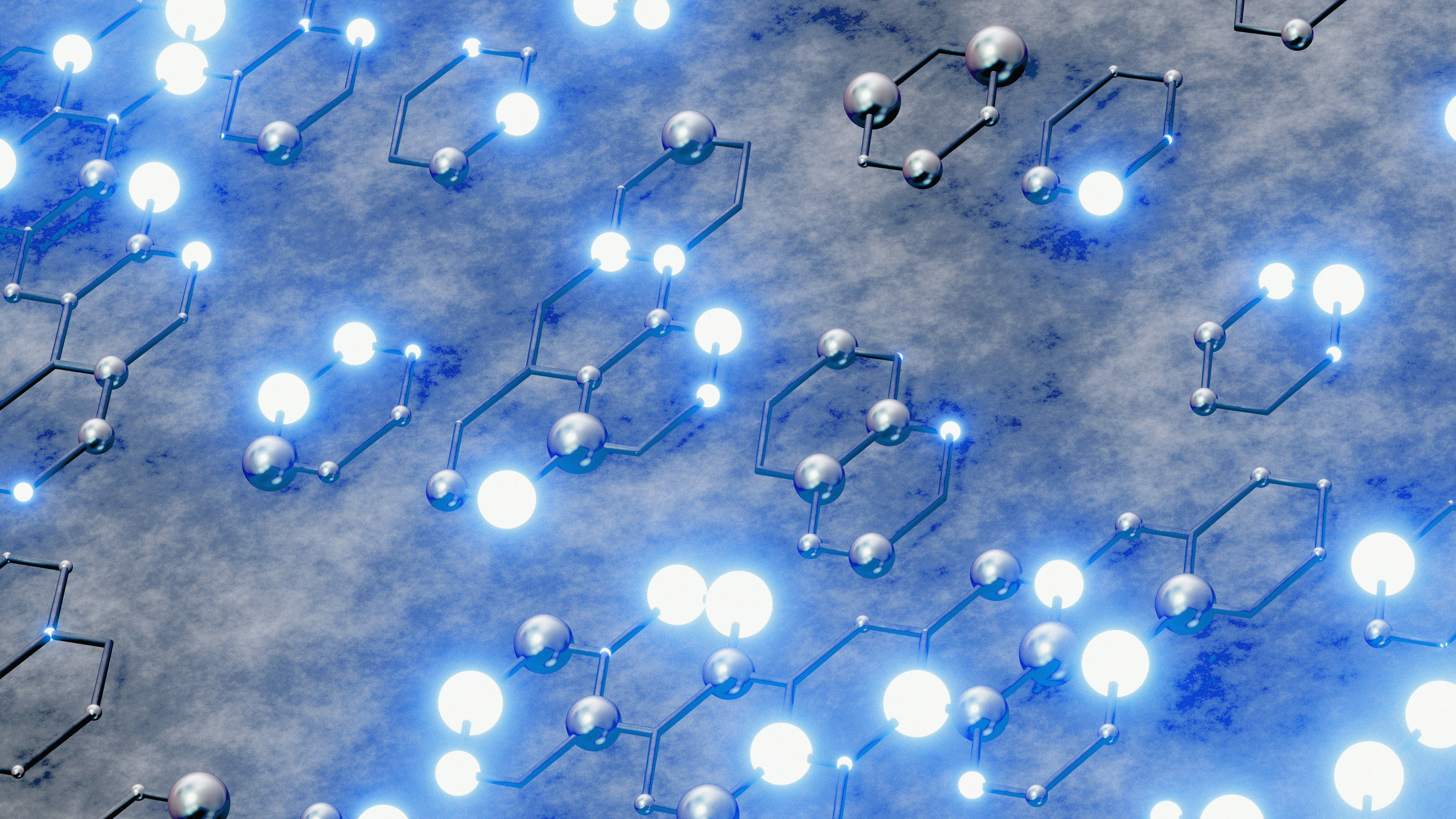 Photo by Logan Voss of abstract molecular structure with glowing blue lights on Unsplash