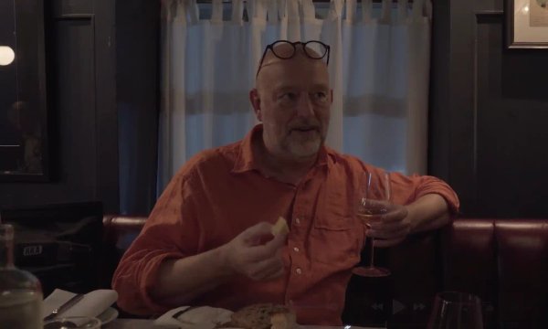 Tim Hayward, FT food columnist and broadcaster, with a glass of white wine during filming for Ourglass Taste Decoded.