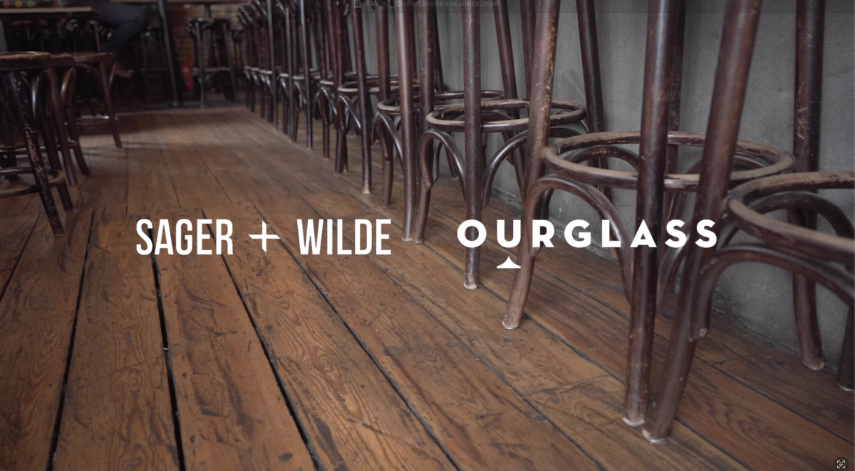 Close-up of vintage bentwood stools and worn wooden flooring at Sager + Wilde, an East London natural wine bar featured in the Ourglass Tapes video series.