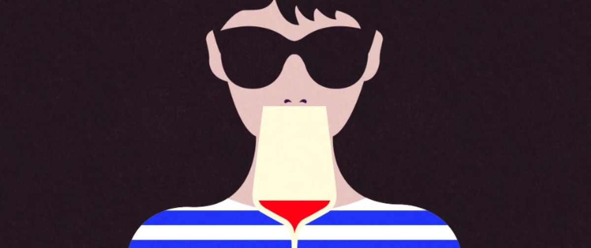 Person in sunglasses and striped shirt tasting wine, illustrating the proper technique for smelling and sipping