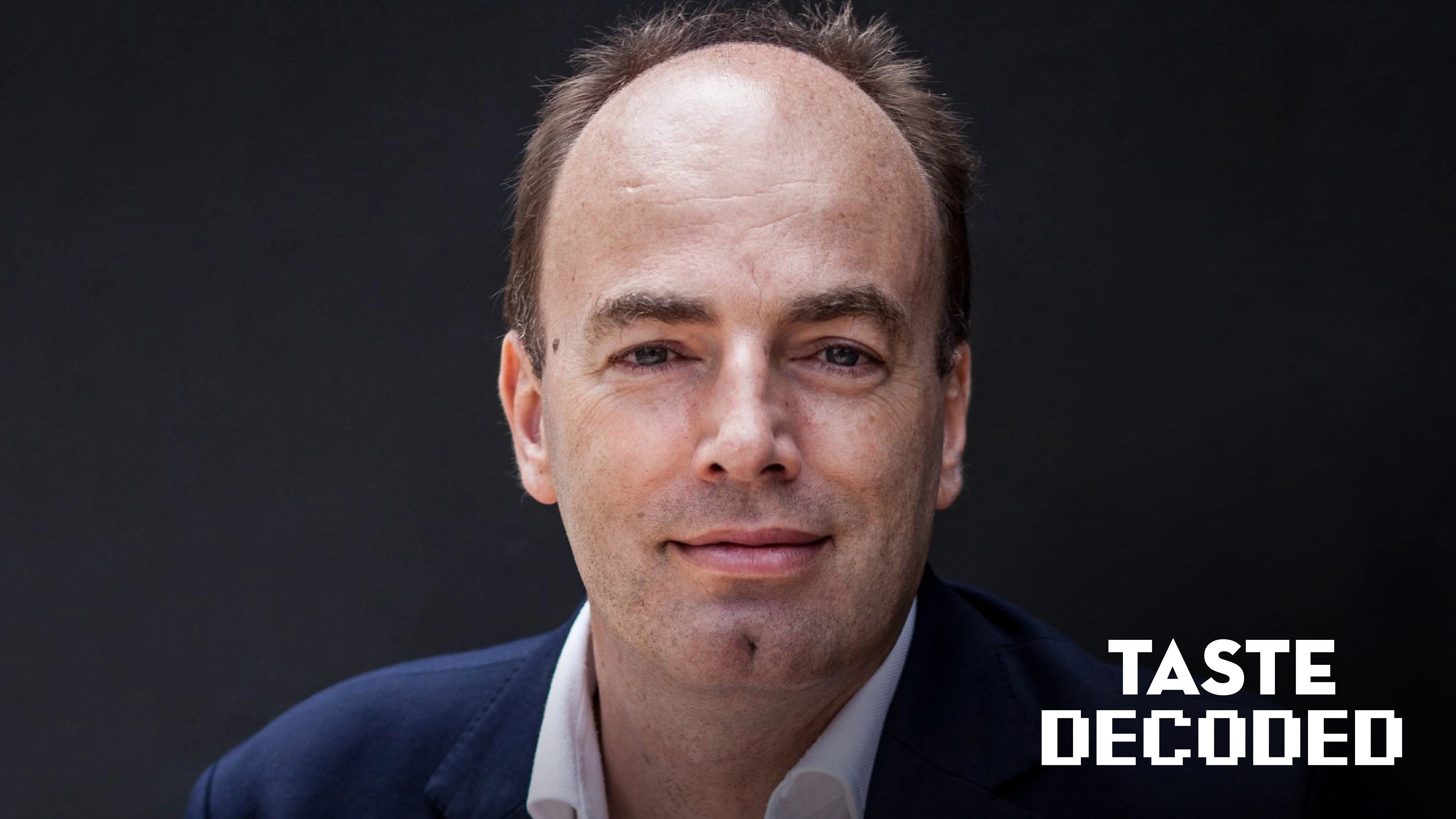 Charles Spence holding wine glass for Taste Decoded series on wine psychology