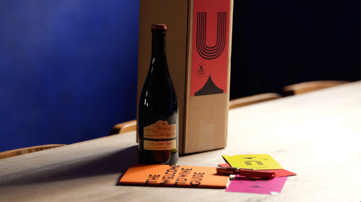Ourglass wine subscription box with bottle of Les Grands Teppes by Jean-François Ganevat, Welcome to Wine guide, tasting notes cards, and Ourglass corkscrew