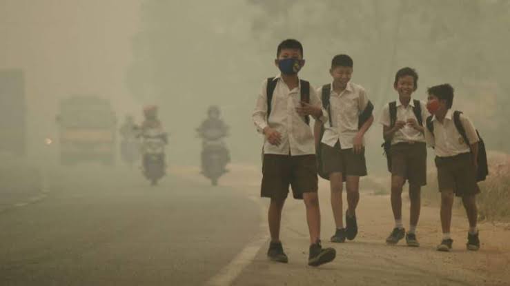 Children learning and playing while protected from air pollution