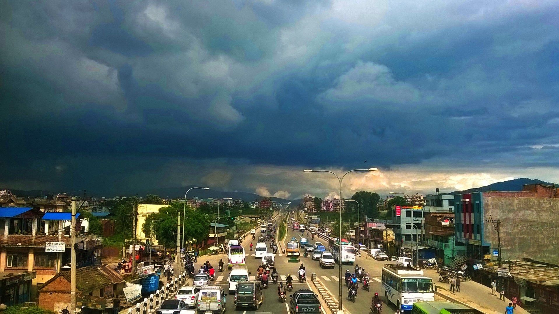 Rain falling over Kathmandu and washing particles from the air