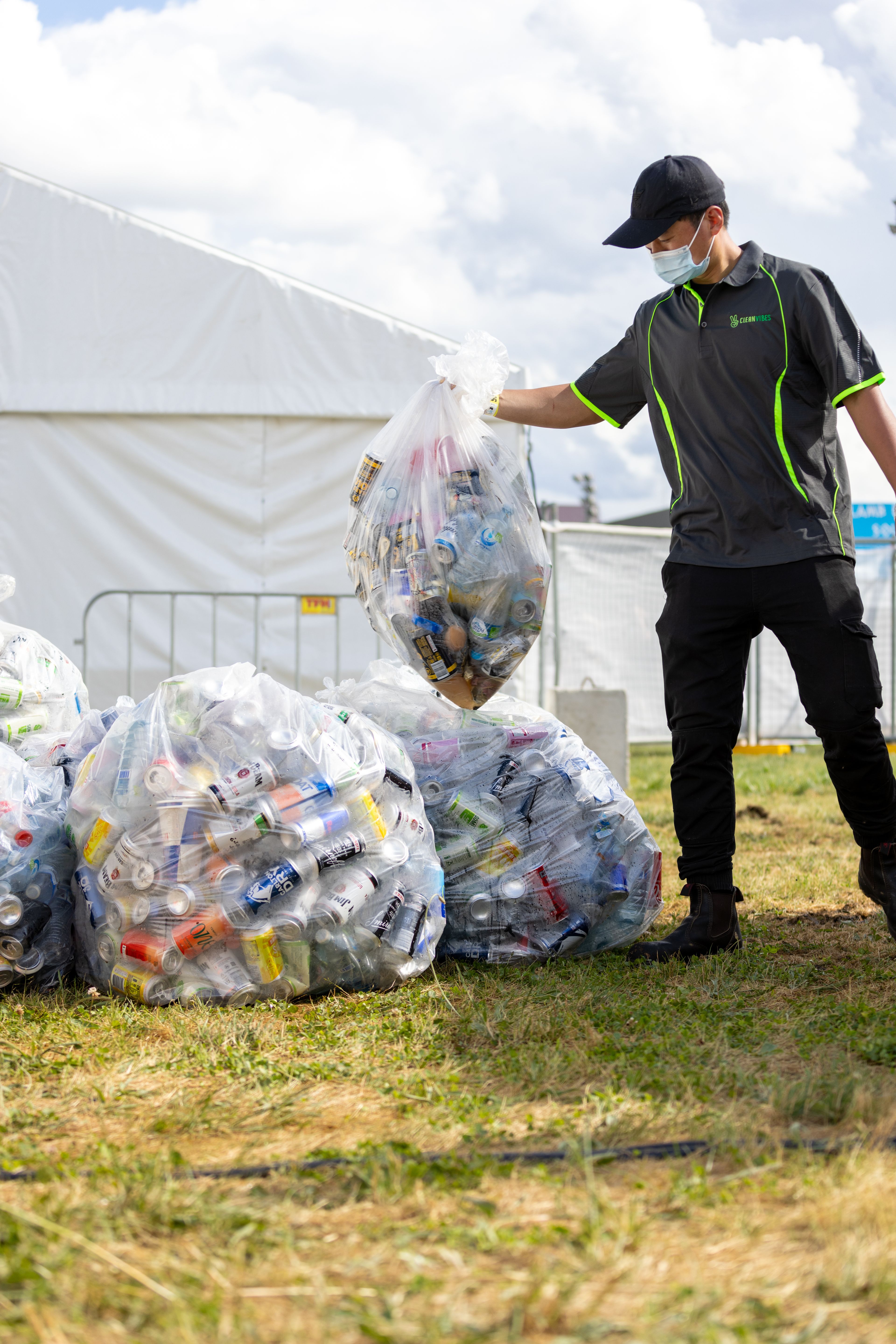 Staff collecting bags full of recyclable drinks 