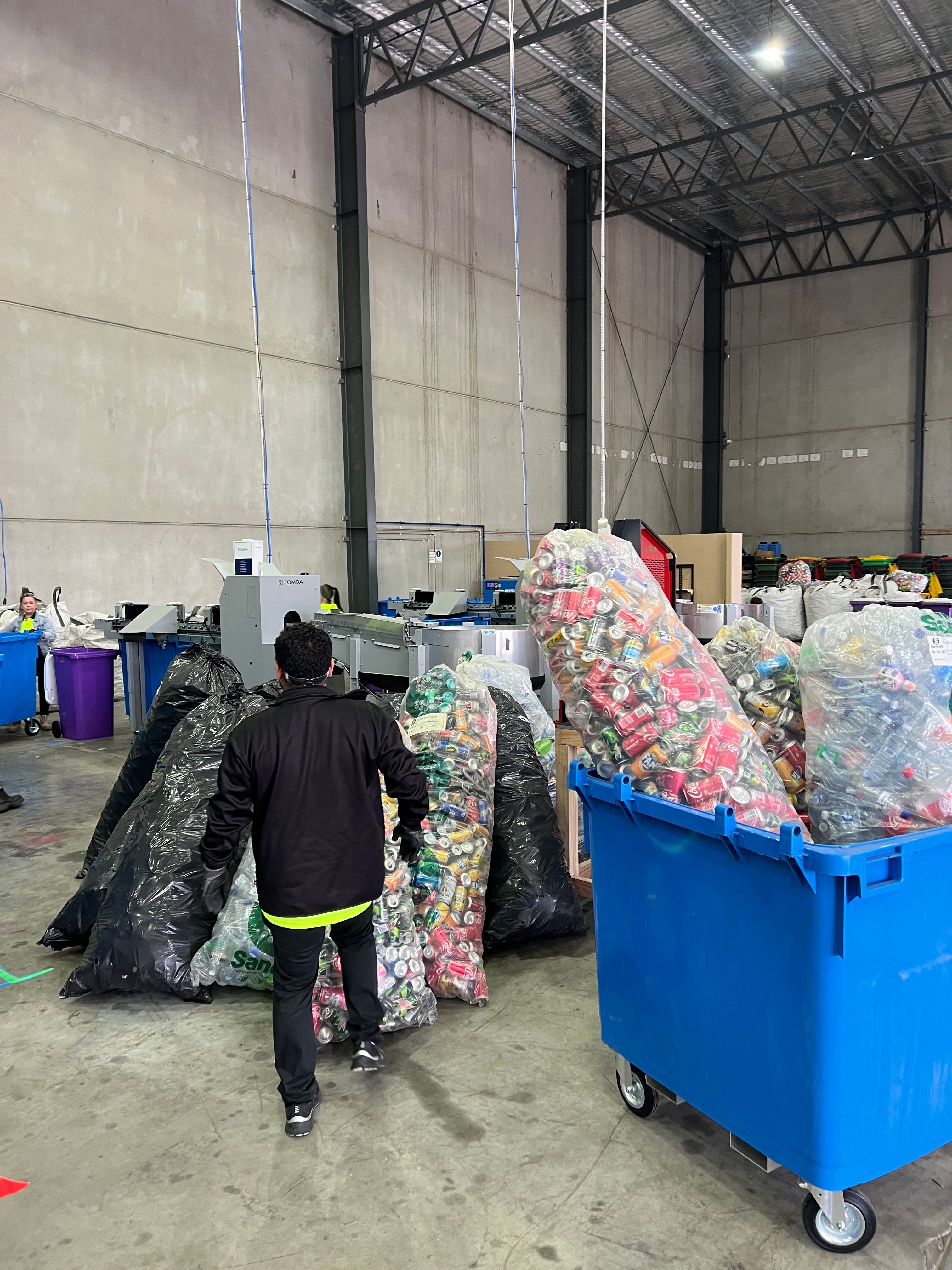 City Return & Earn warehouse full of bulk recyclable containers