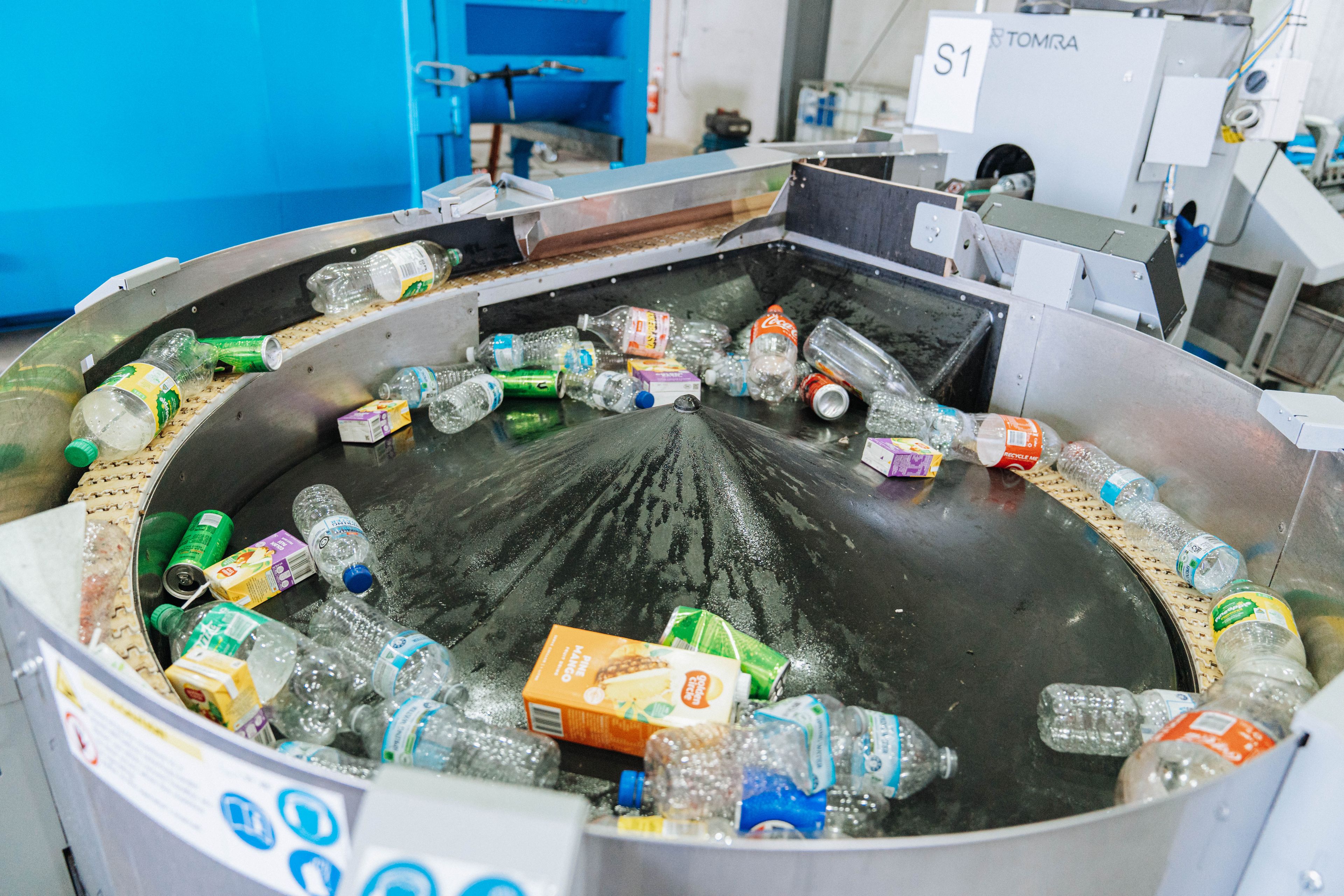 Mix of recyclable containers in a machine at Mascot depot