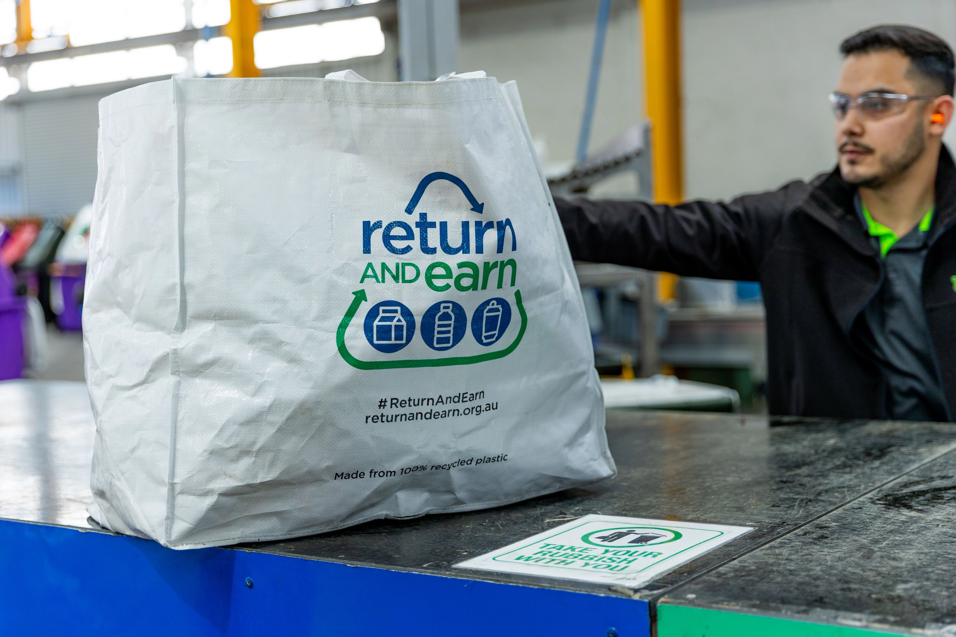 Return & Earn bag with empty eligible containers