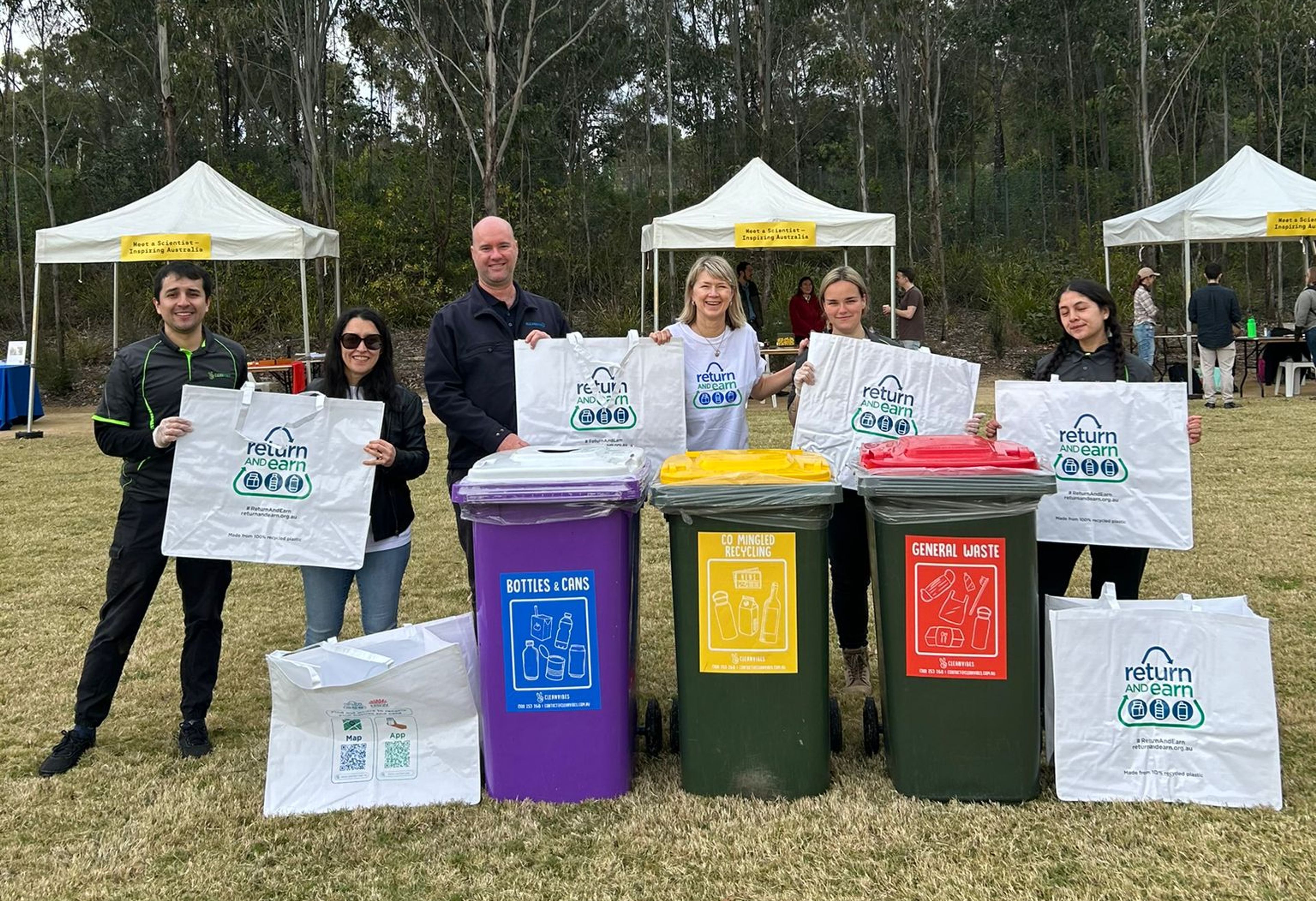 City Return & Earn Team olding bags to collect recyclable containers