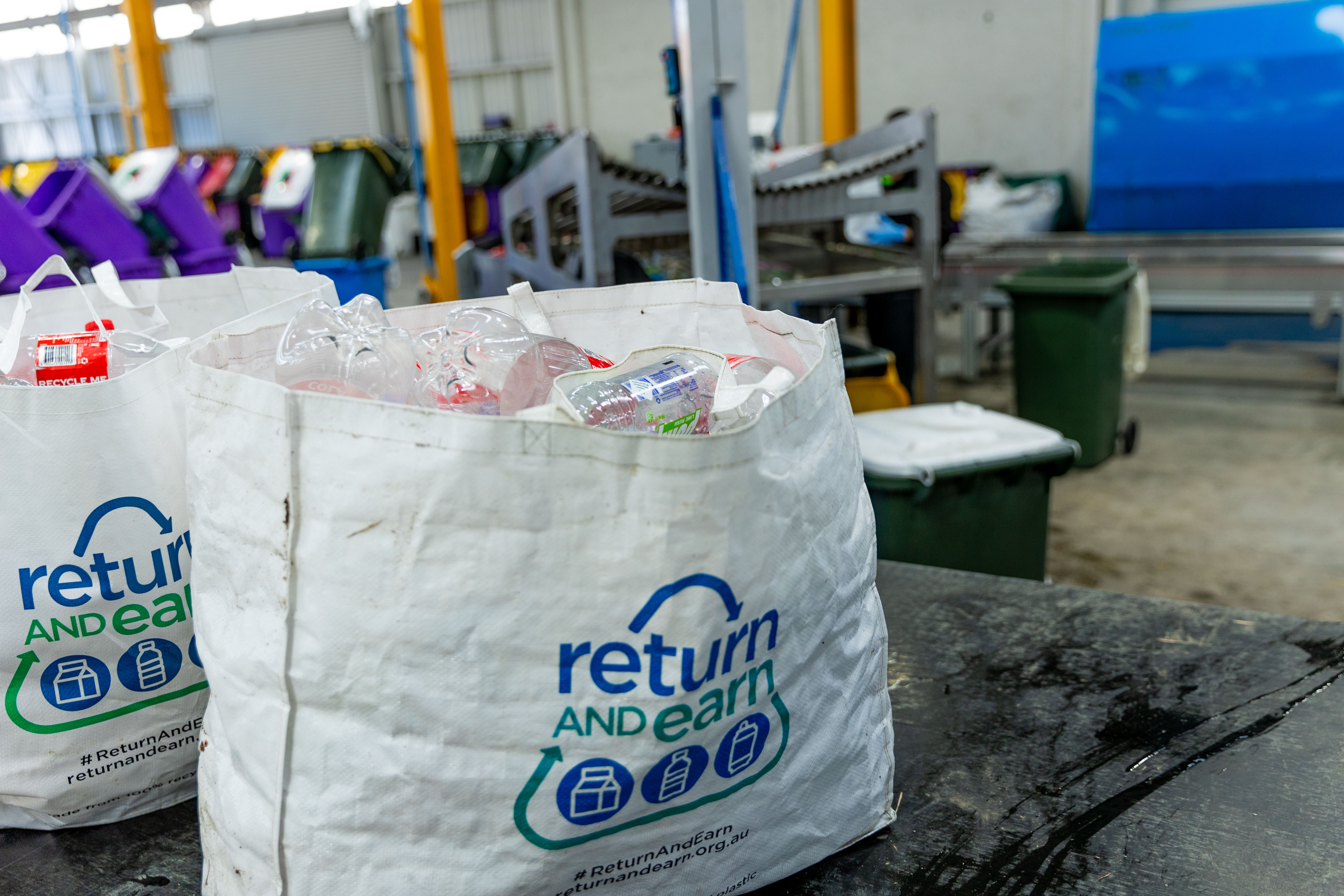 Bottles and containers in Return and Earn bag 