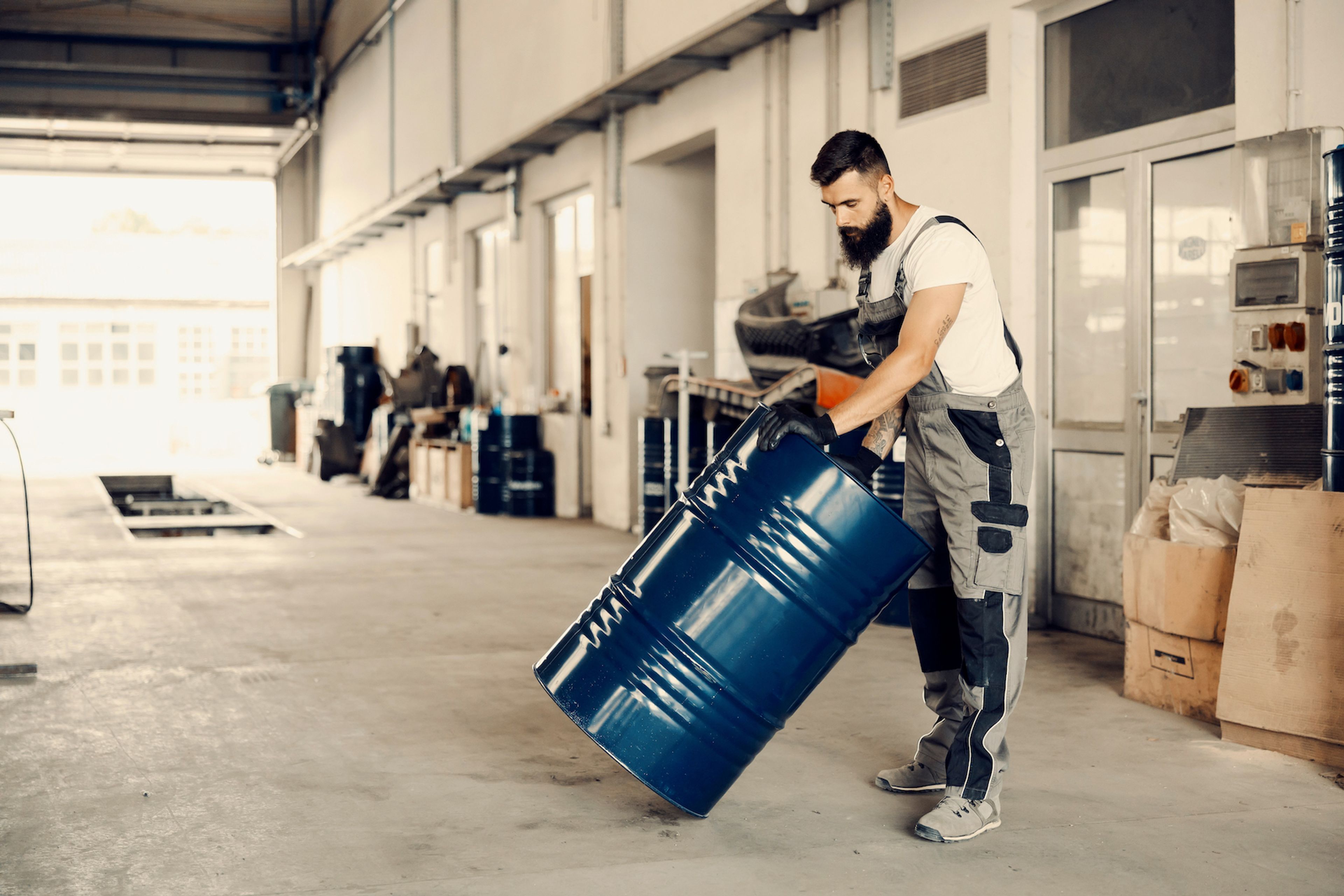 Man moving a barrel