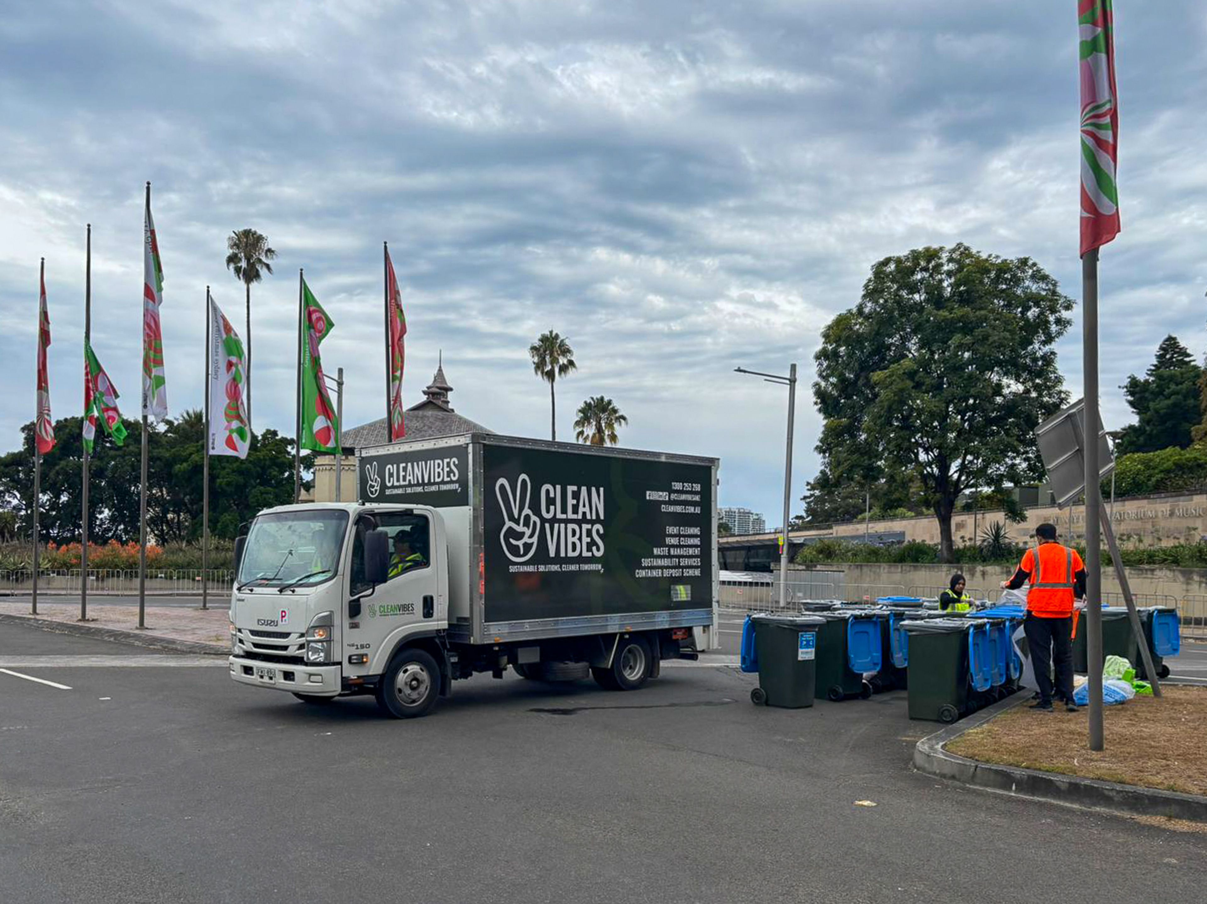 Truck picking up bins 