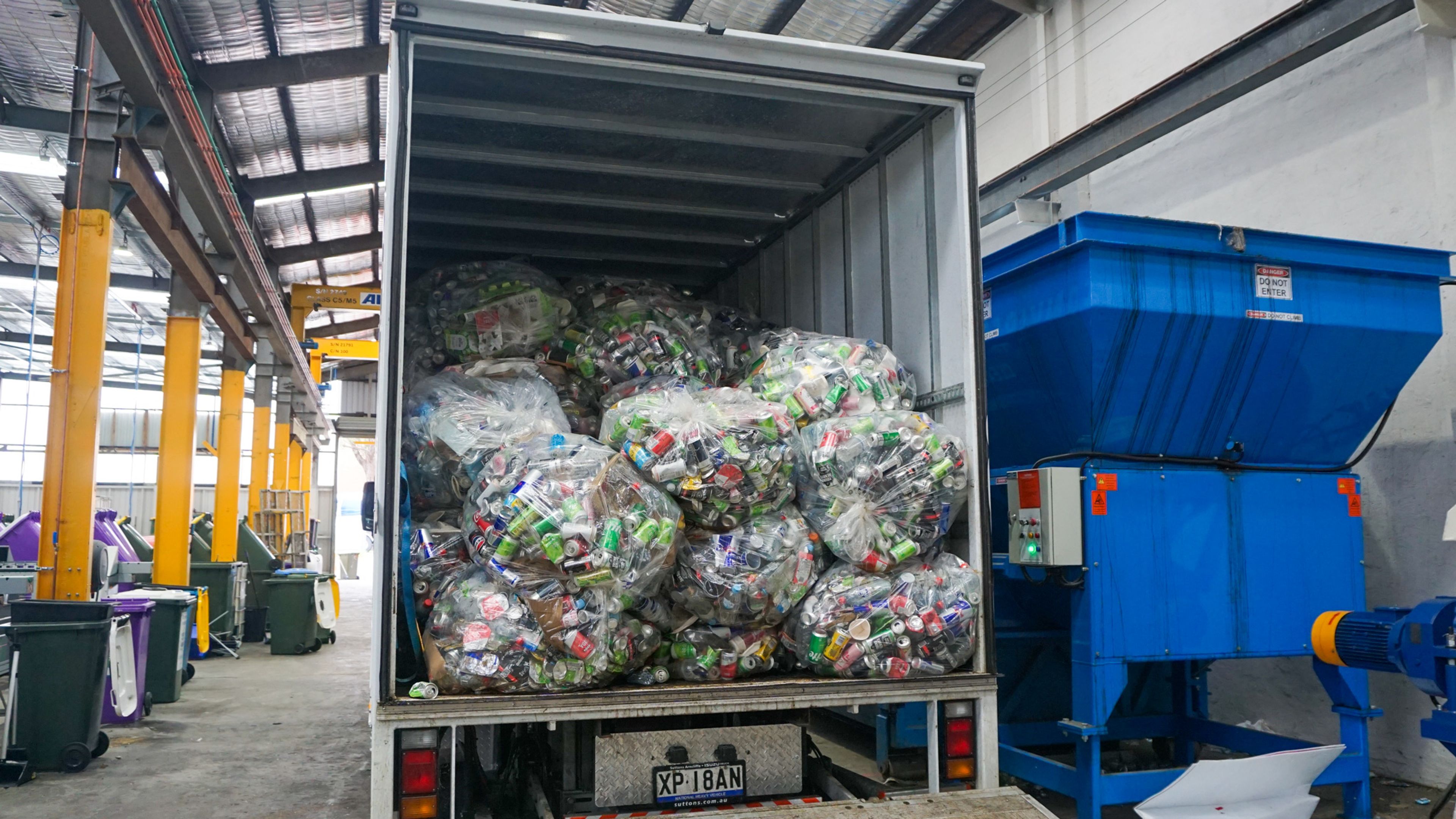 City Return & Earn truck collecting bulk empty cans and plastic bottles