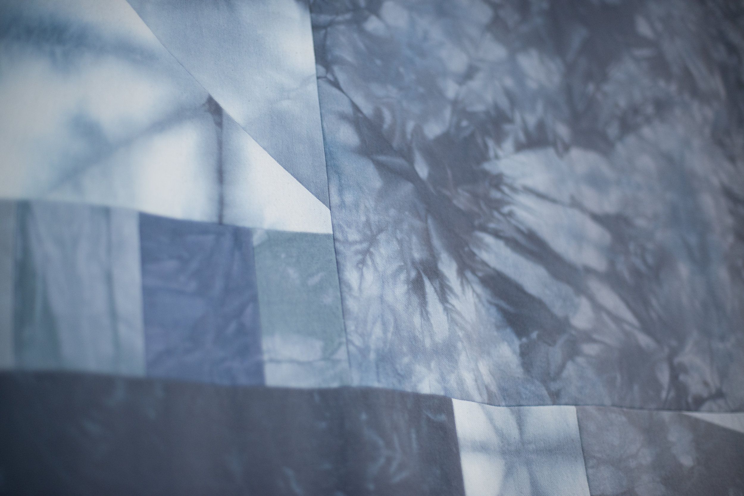 Abstract blue and white geometric and marbled fabric pattern