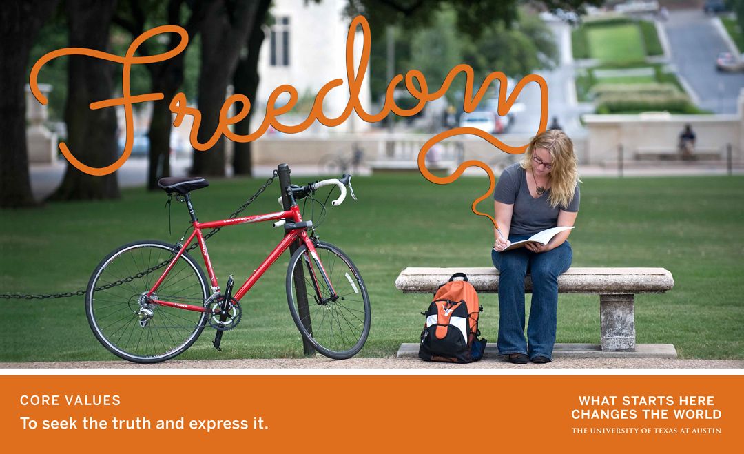 Student reading on campus bench beside bicycle under word “Freedom”