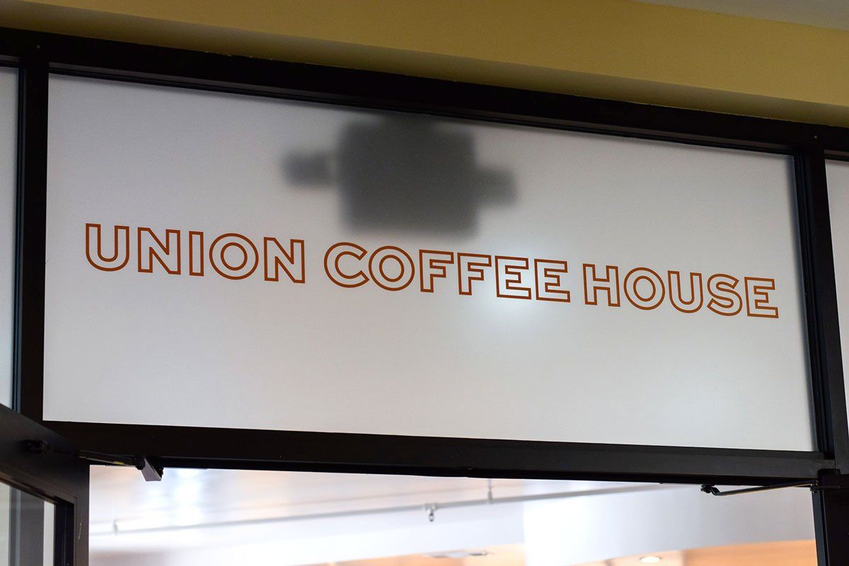 Entrance sign reading “UNION COFFEE HOUSE” above interior doorway