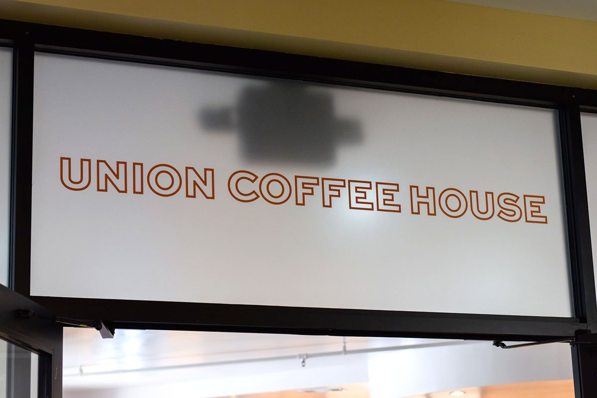 Entrance sign reading “UNION COFFEE HOUSE” above interior doorway