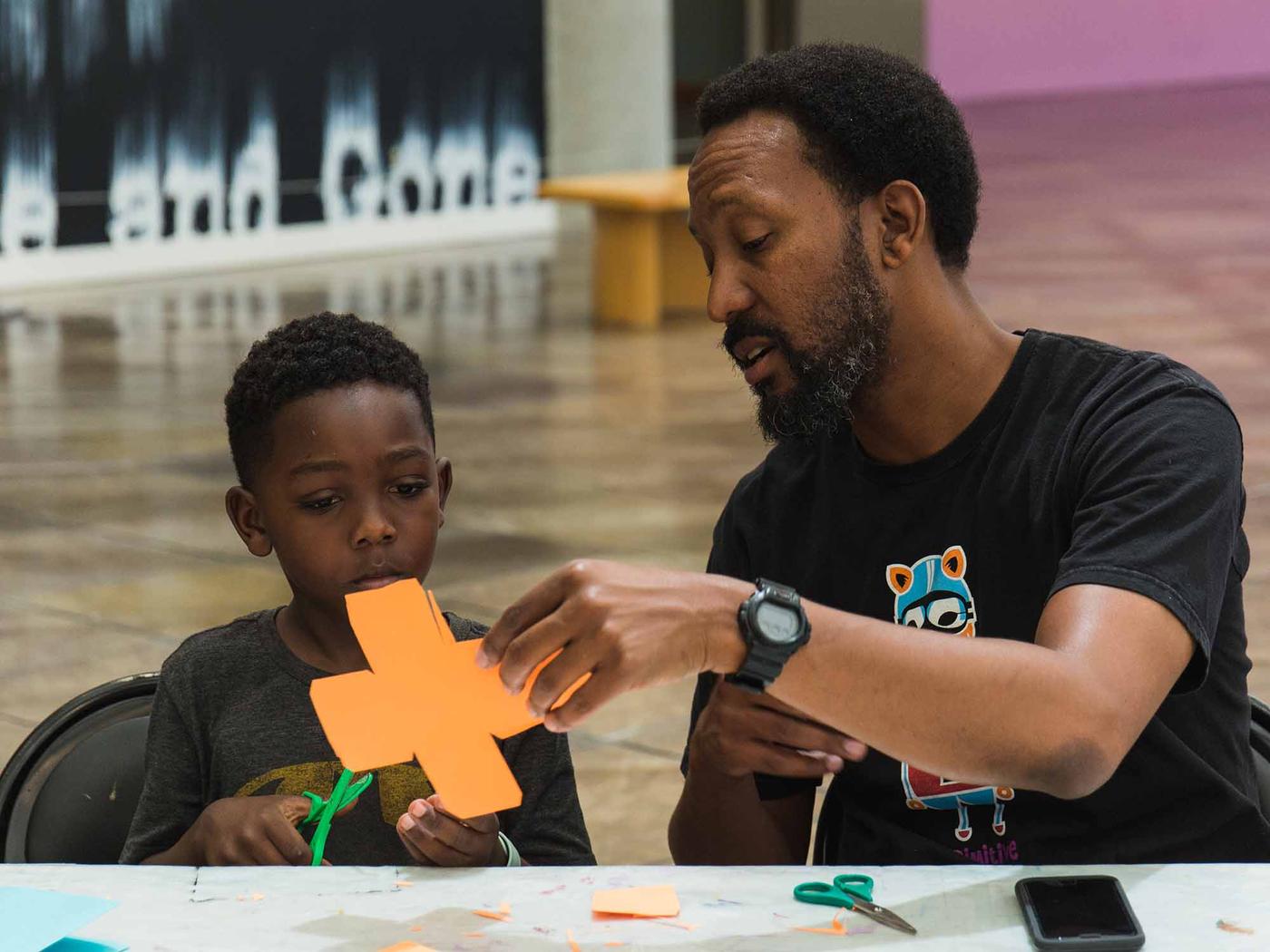 Family participating in an art workshop