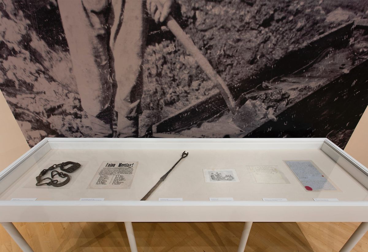 Installation view of tools of bondage and ephemera