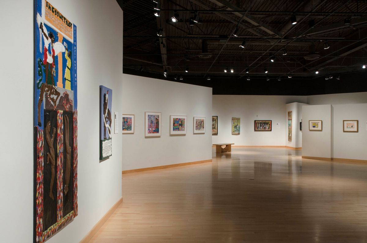 Installation view of framed artworks and large scale paintings