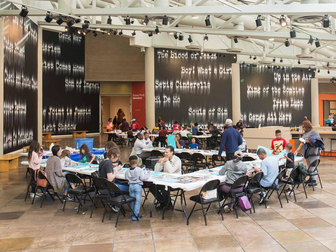 Families participating in an art workshop