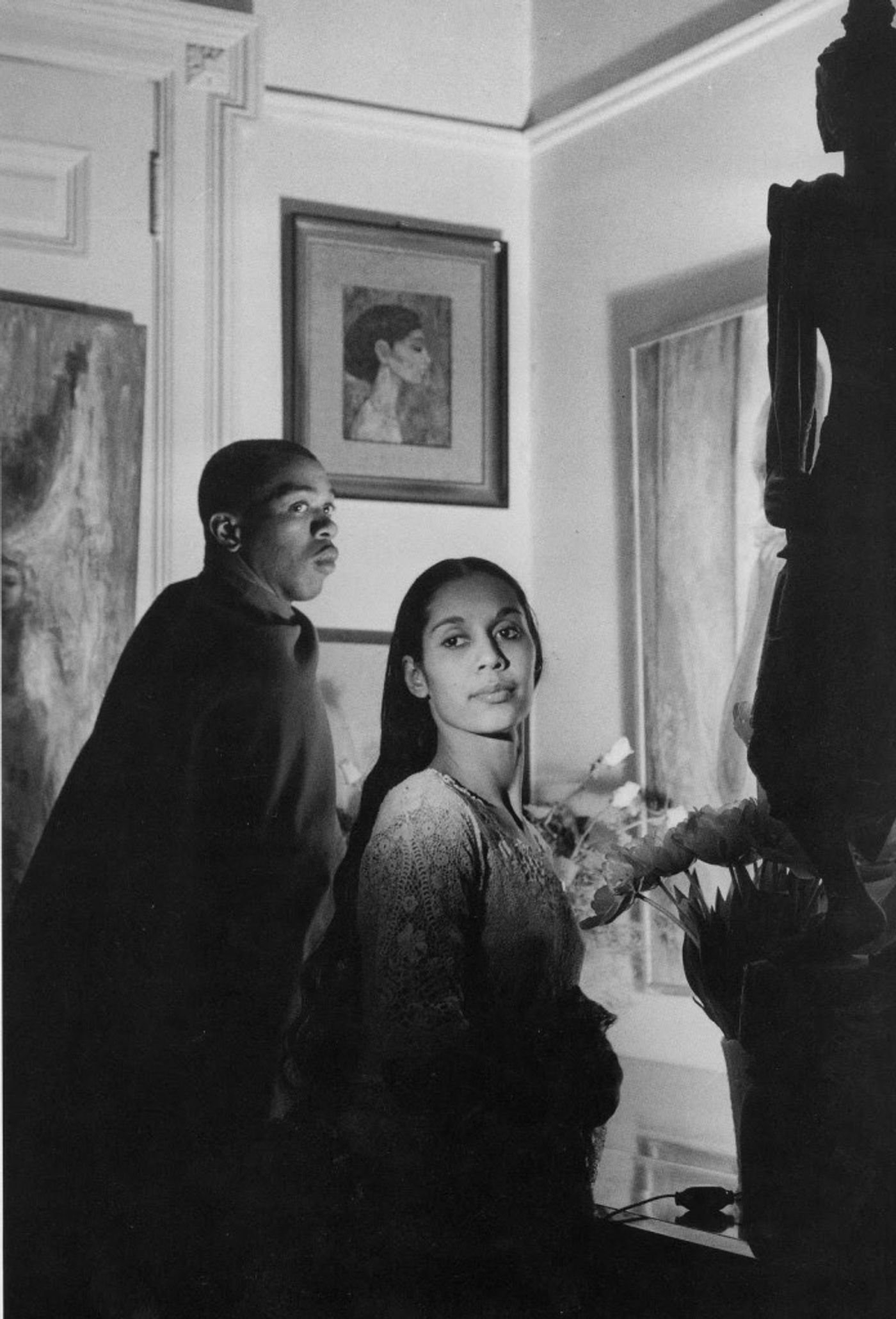 Black and white image of Carmen de Lavallade and Geoffrey Holder in dramatic lighting