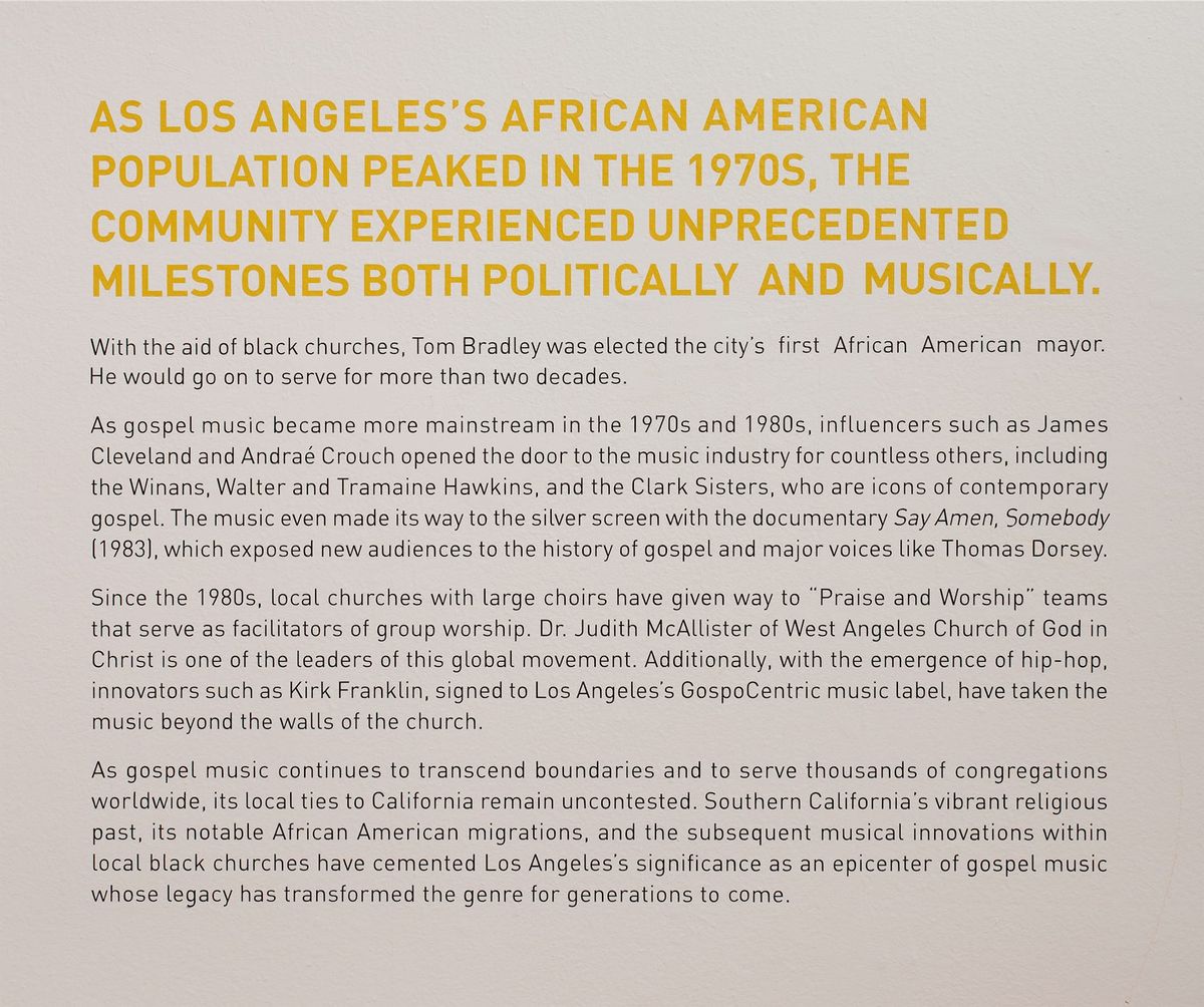 Installation view of wall text about the 1970s - today