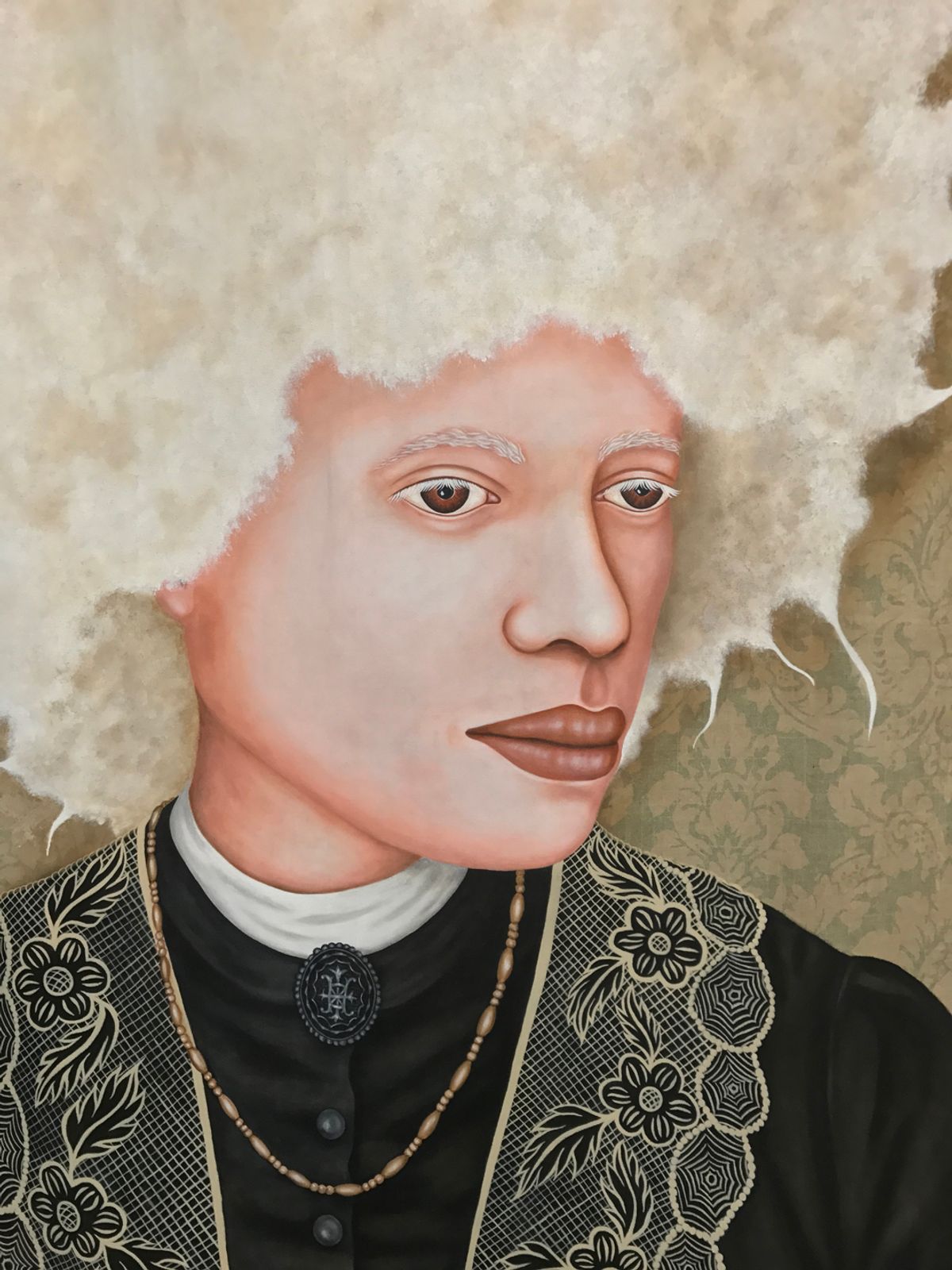 Close look at very blond Black woman with a tall coily afro