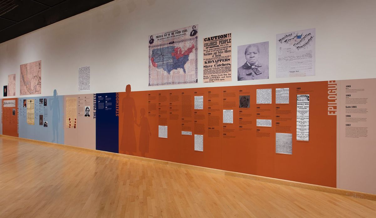 Timeline running the width of gallery with posters of Ms. Biddy Mason and announcements of slave catchers