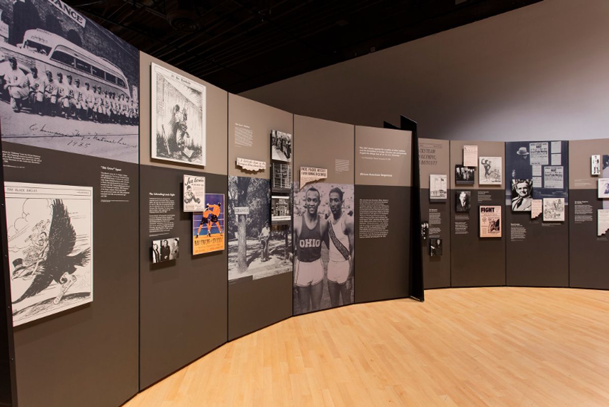 Installation view of wall text and athlete photos