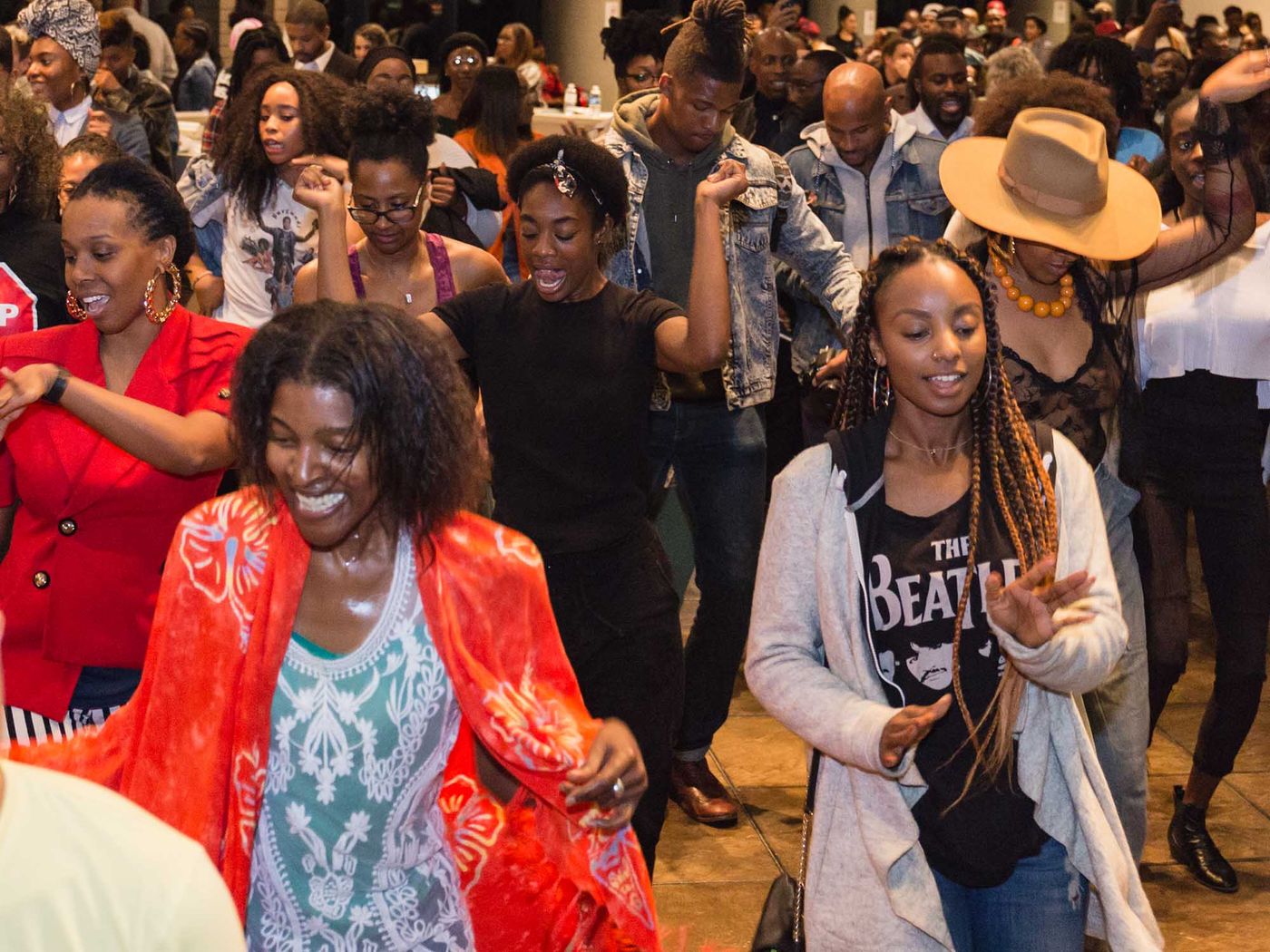 Black people smiling and enjoying dance at CAAM event