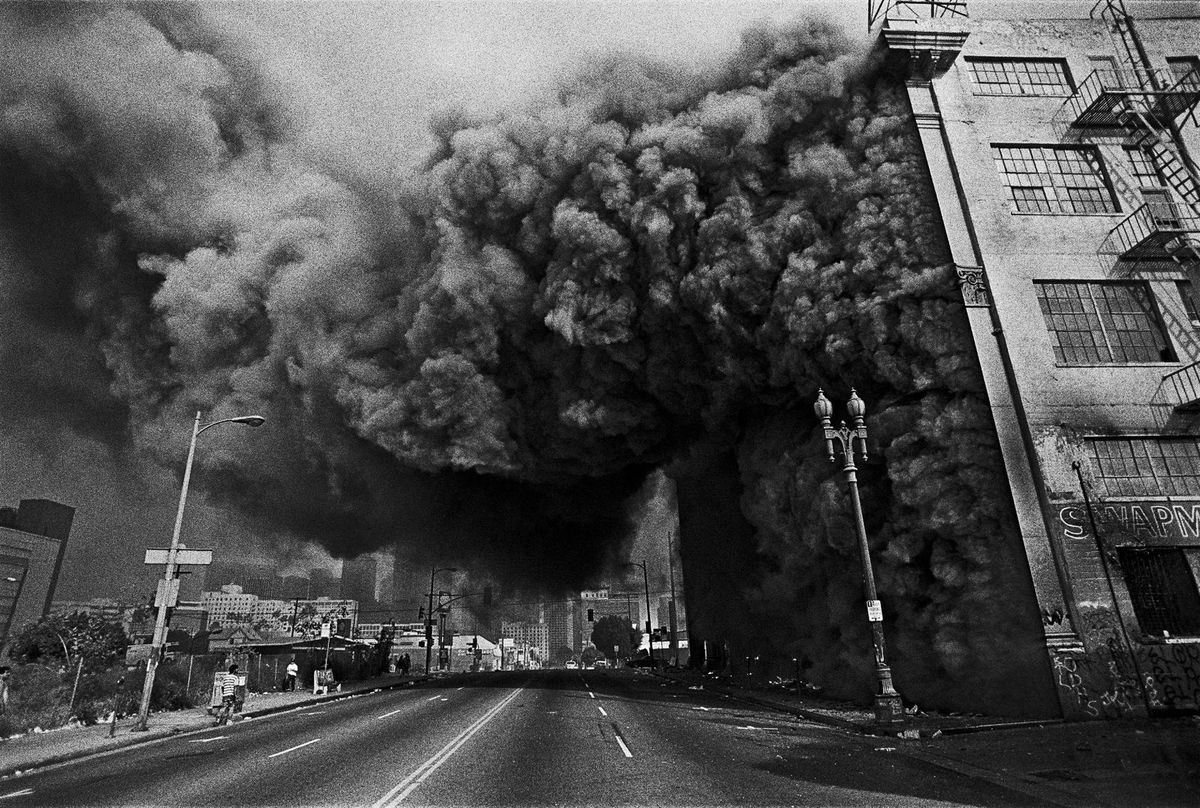 Street view of a building is ablaze during the Los Angeles Uprising 1992