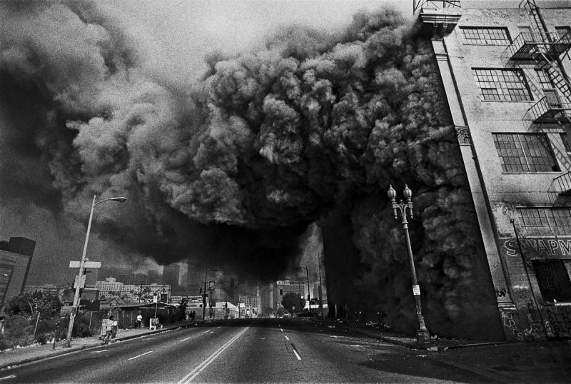 Street view of a building is ablaze during the Los Angeles Uprising 1992