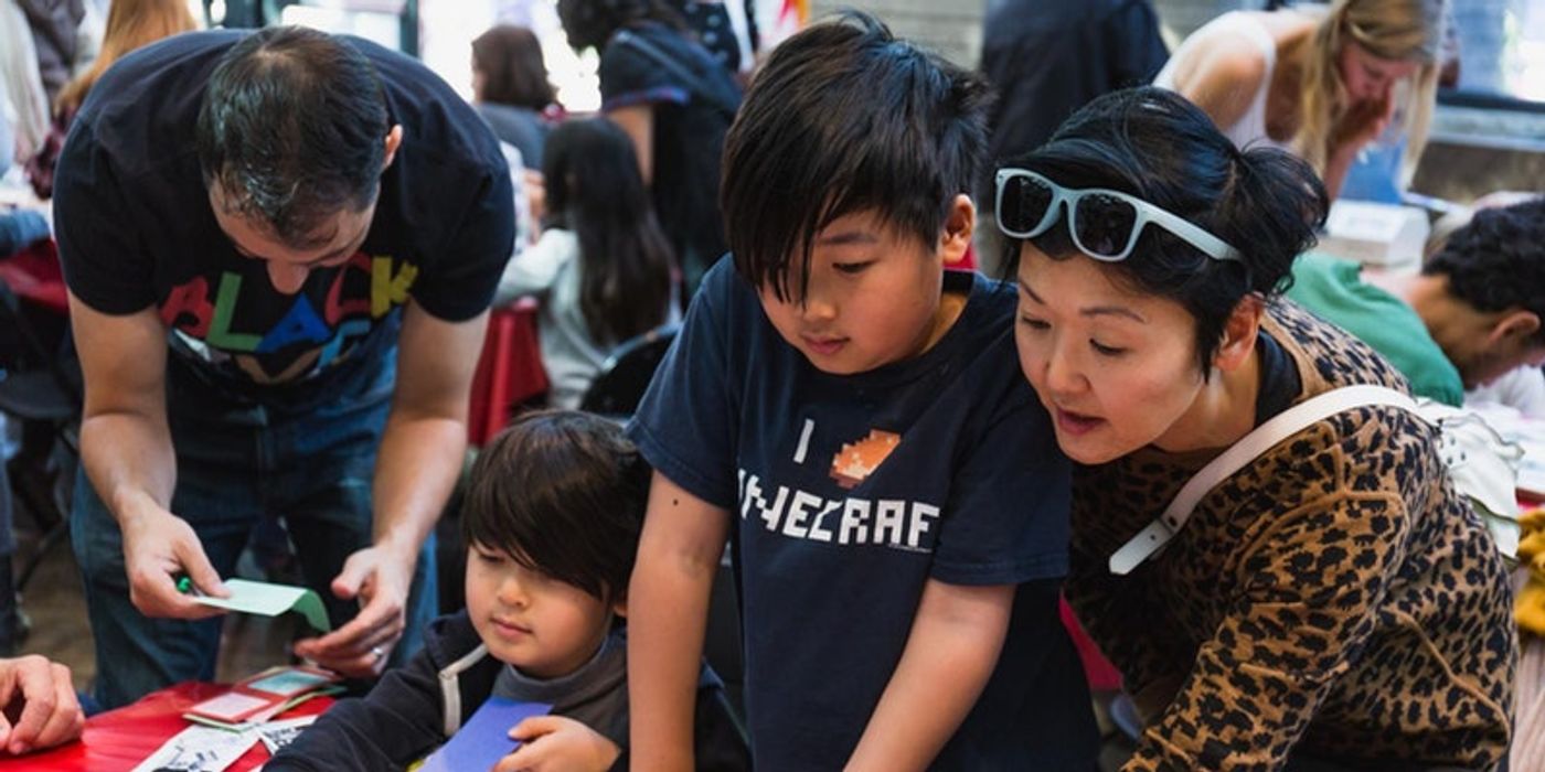 Families enjoying an art workshop