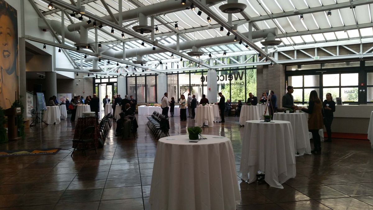 Atrium set up with tall cocktail tables for mixer