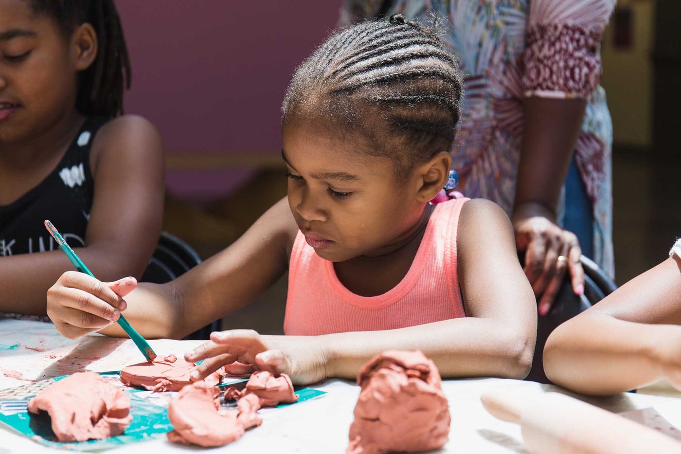 Child with geo-pattern cornrows
