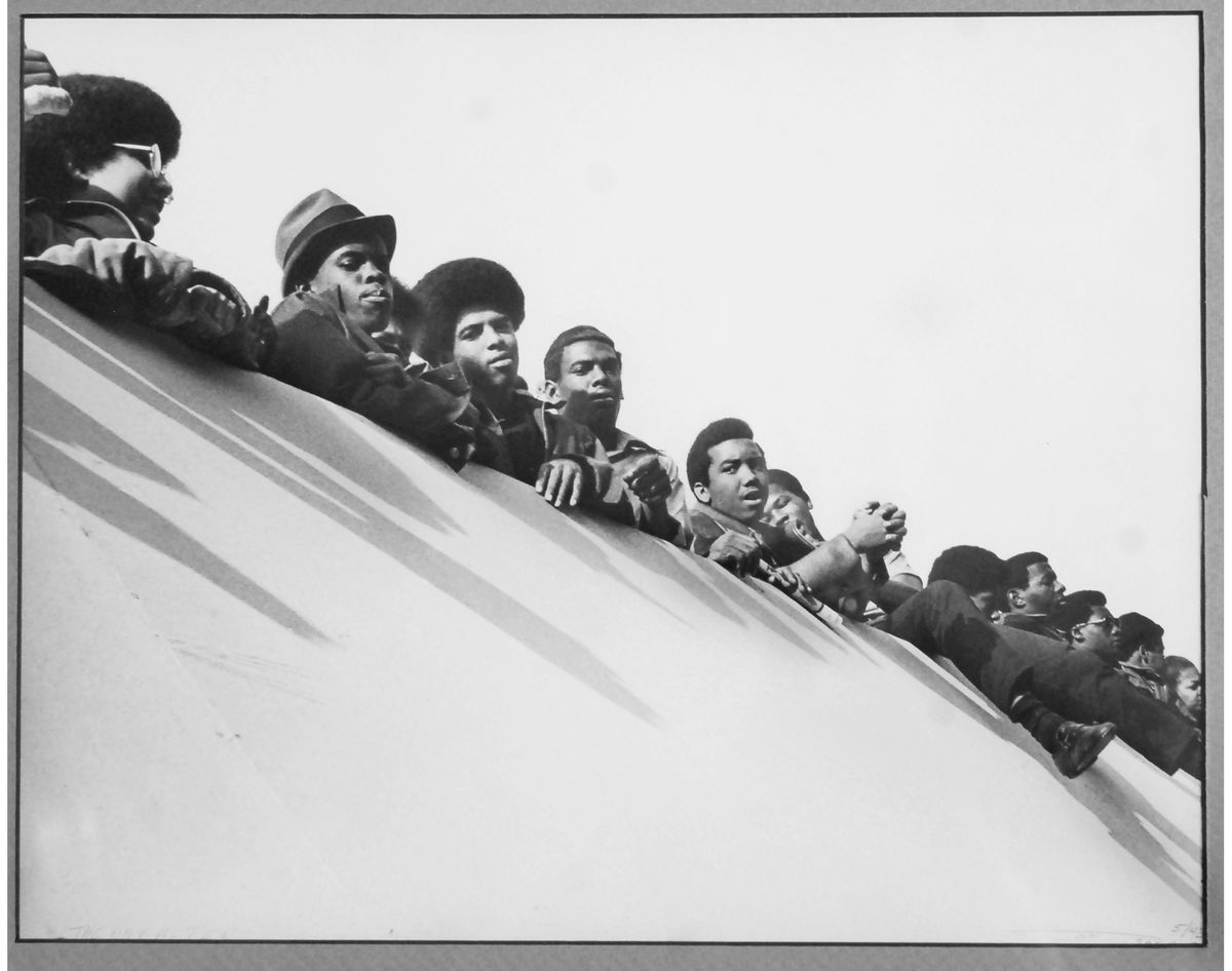 Group of young men looking out from edge of rooftop