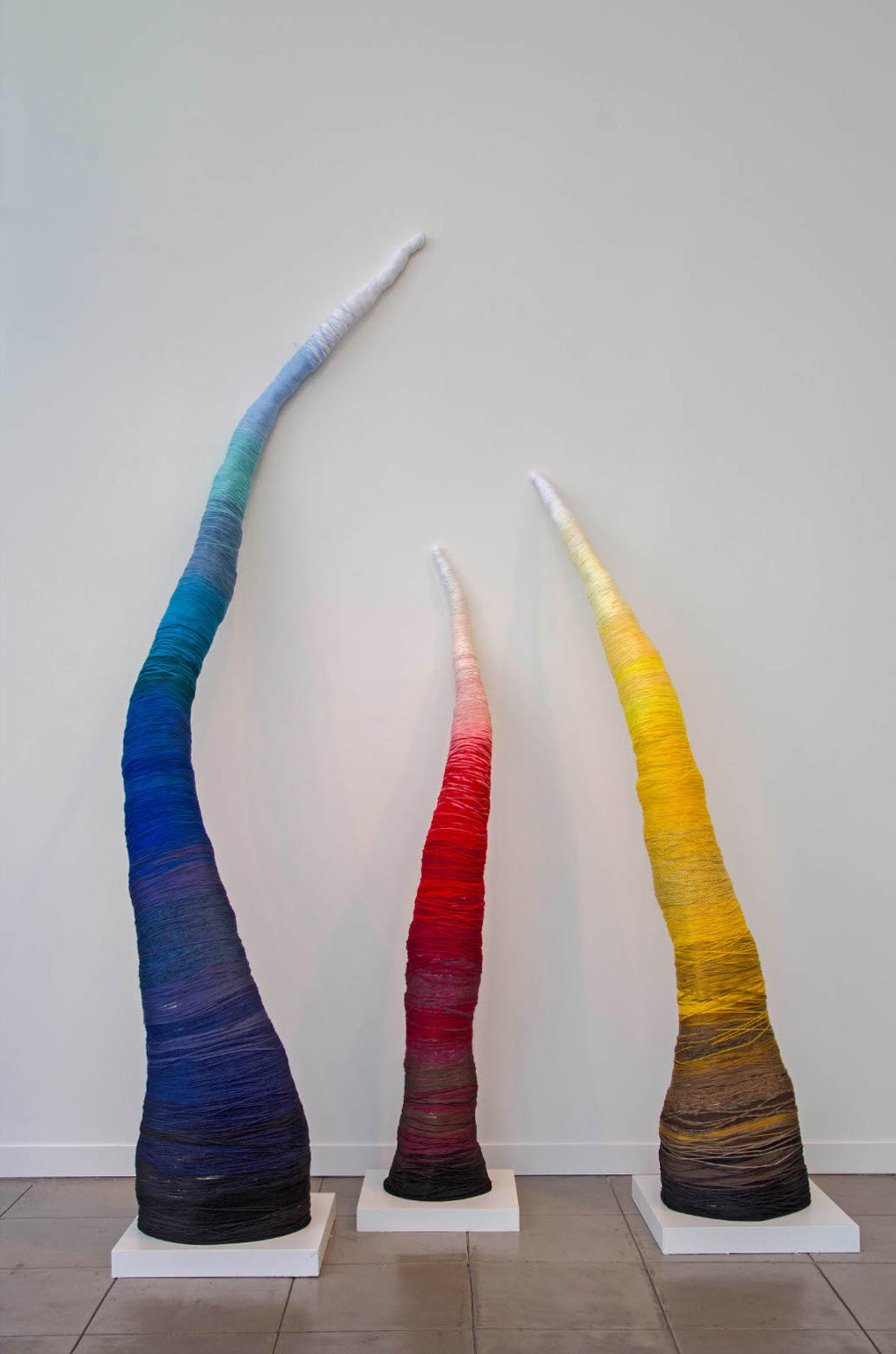 Trio of mixed media spires