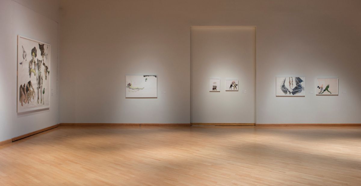 Installation view of intentionally spartan sequencing of black on white artworks