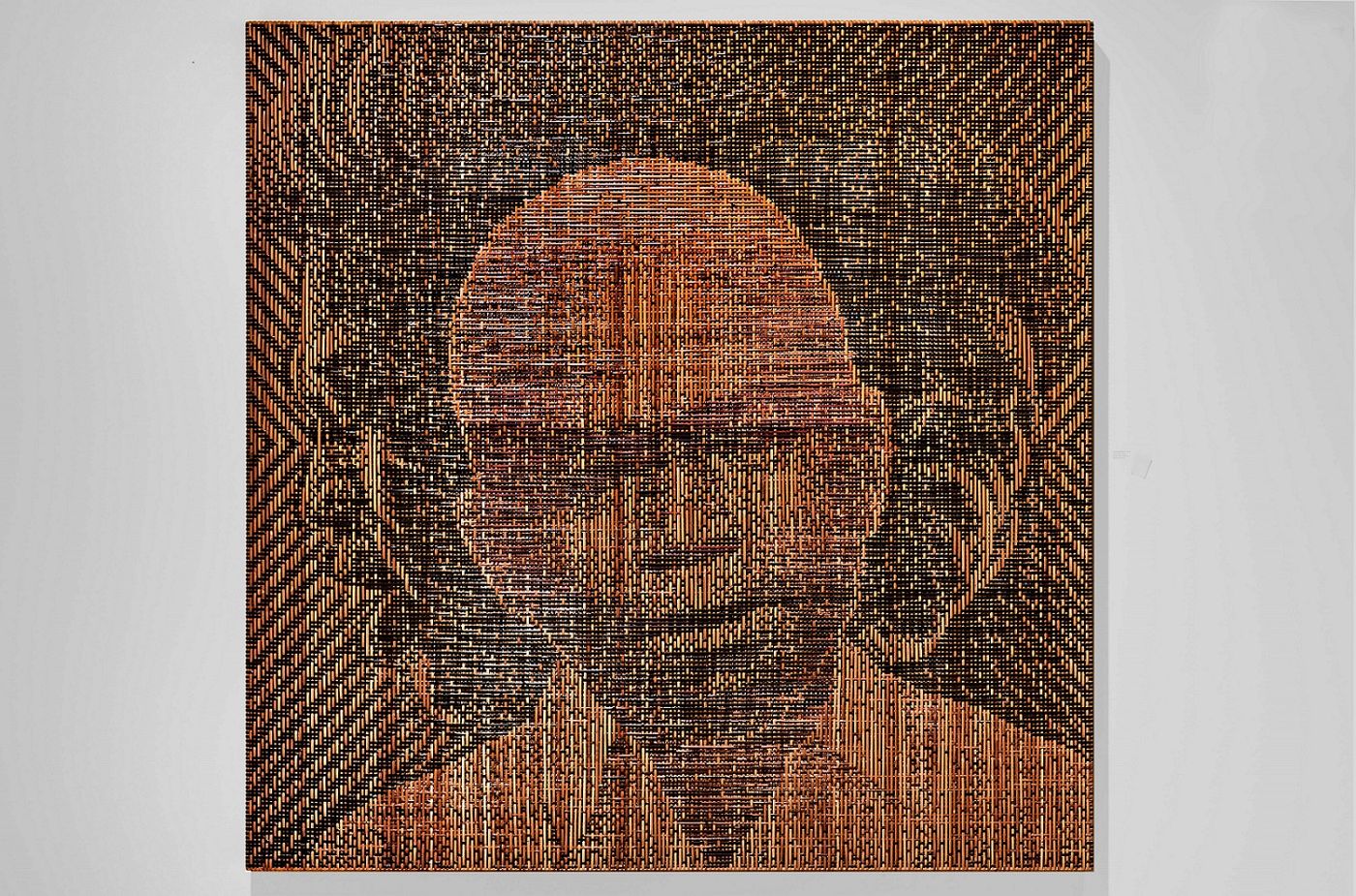 Colored rattan woven to reveal the portrait in contrast