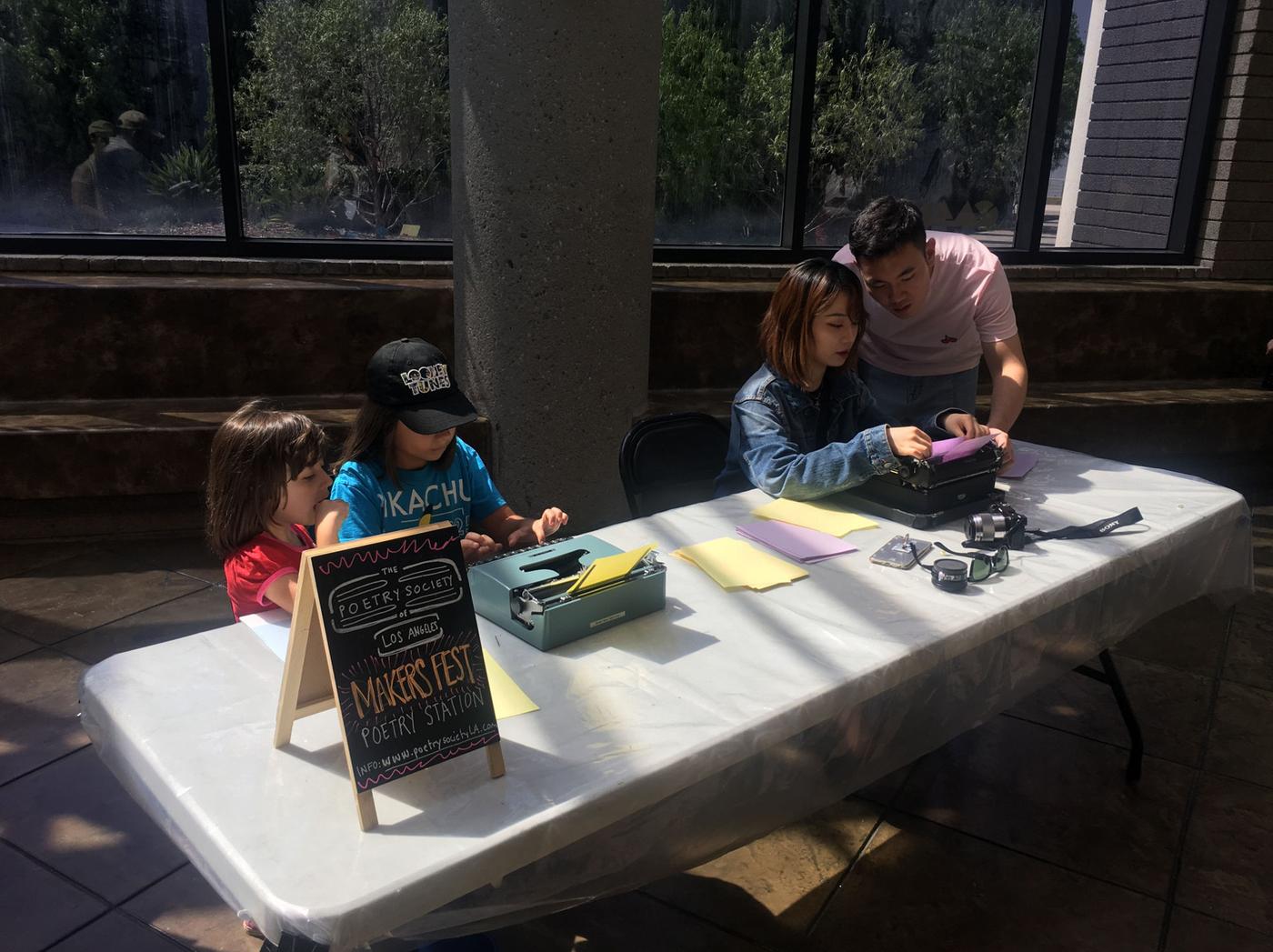 Young students working on 1970s vintage typewriters