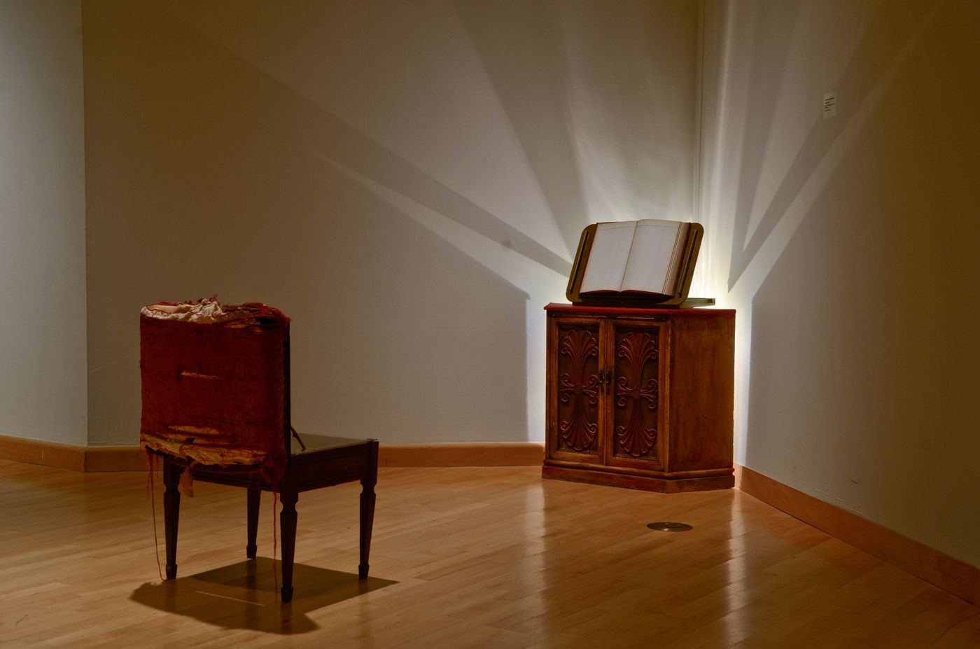 Installation with cabinet, book holder, and piano bench