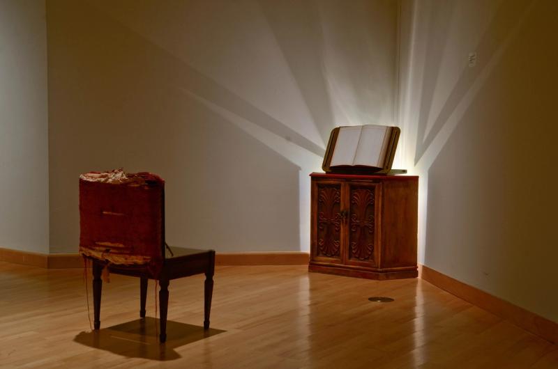 Installation with cabinet, book holder, and piano bench