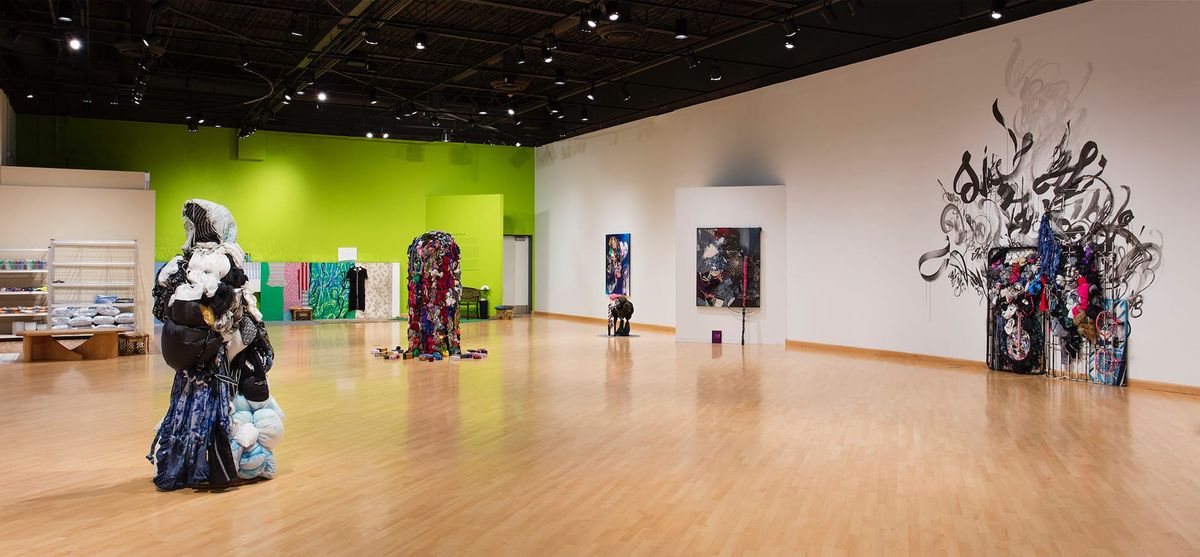 Installation view of sculptures, paintings, and vignettes