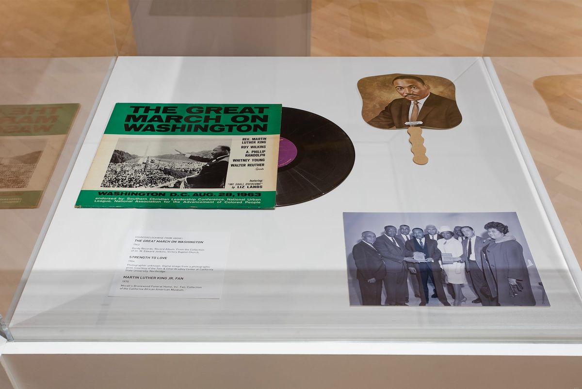 Vitrine view, ephemera from Dr. Martin Luther King Jr.'s visit to California