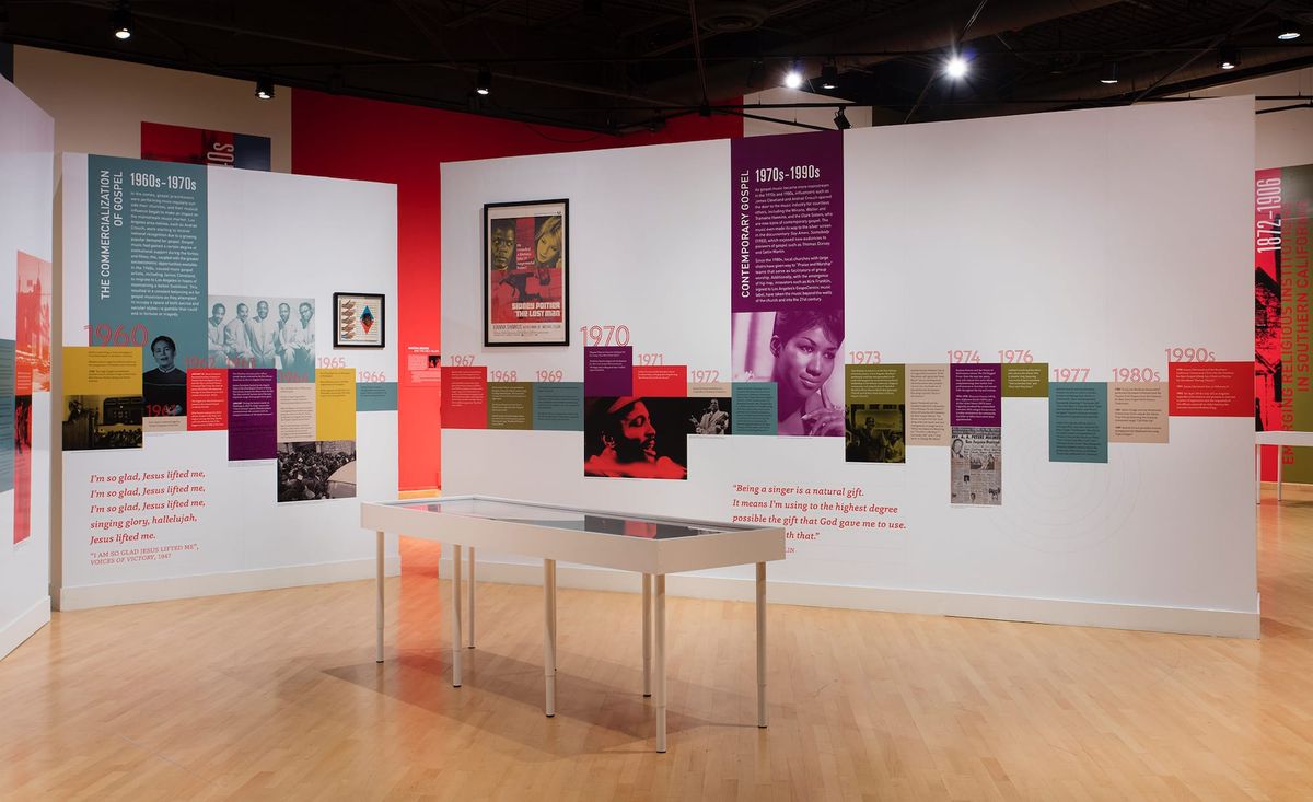 Installation view of photo patchwork and vitrine