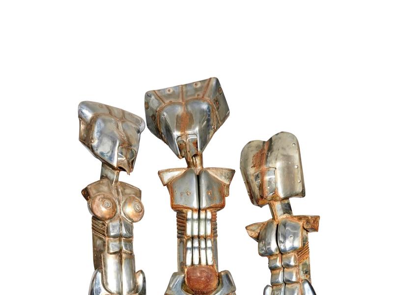 Welded chrome statues of Horus, Isis, and Osiris