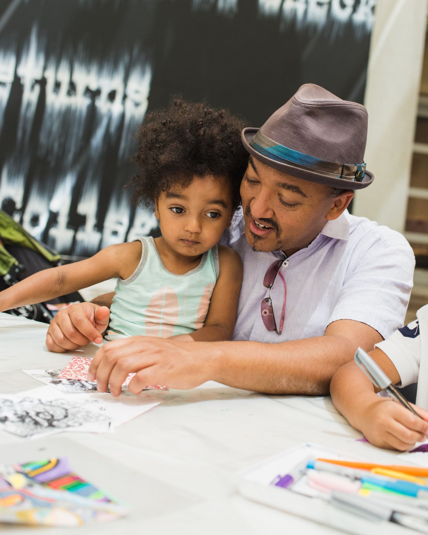 Family participating in an art workshop