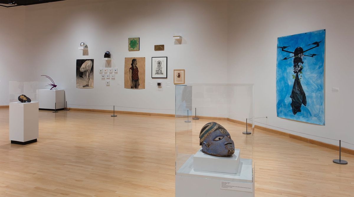 Installation view of sculptures, large paintings, and framed works